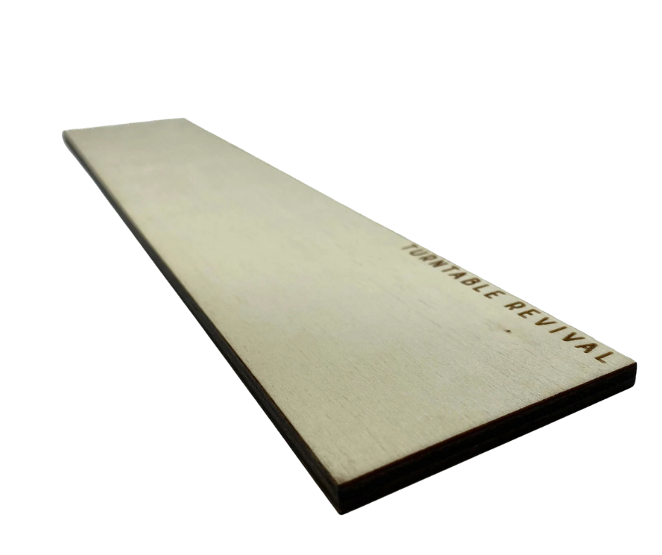 Wooden vinyl record backspacer engraved with the text 'Turntable Revival,' designed for maintaining neat and organized vinyl storage.