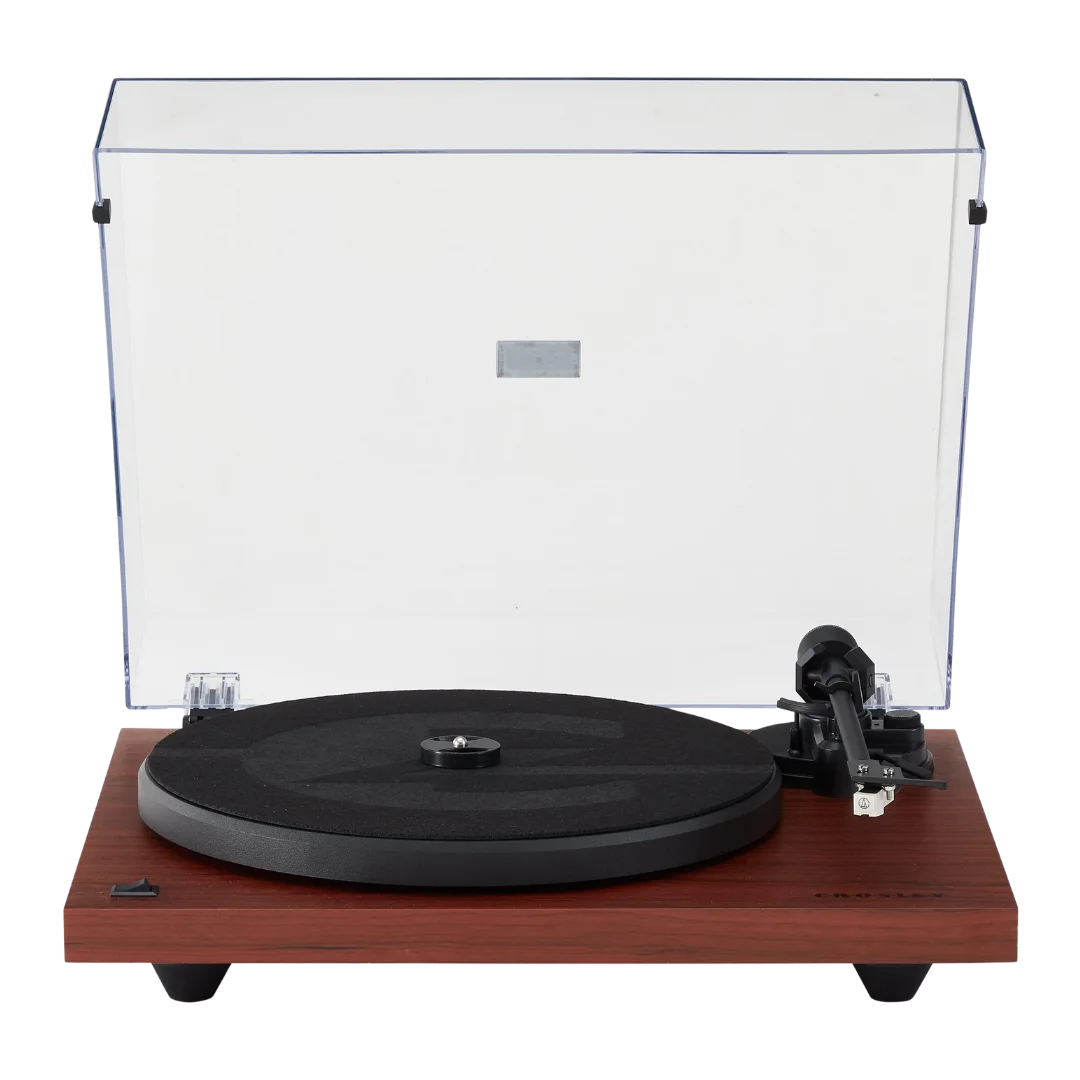 Front view of a Crosley C6 turntable with an open clear dust cover, matte black platter with felt mat, straight tonearm with mounted cartridge, and a wood-finish plinth in rich mahogany color. Ask ChatGPT