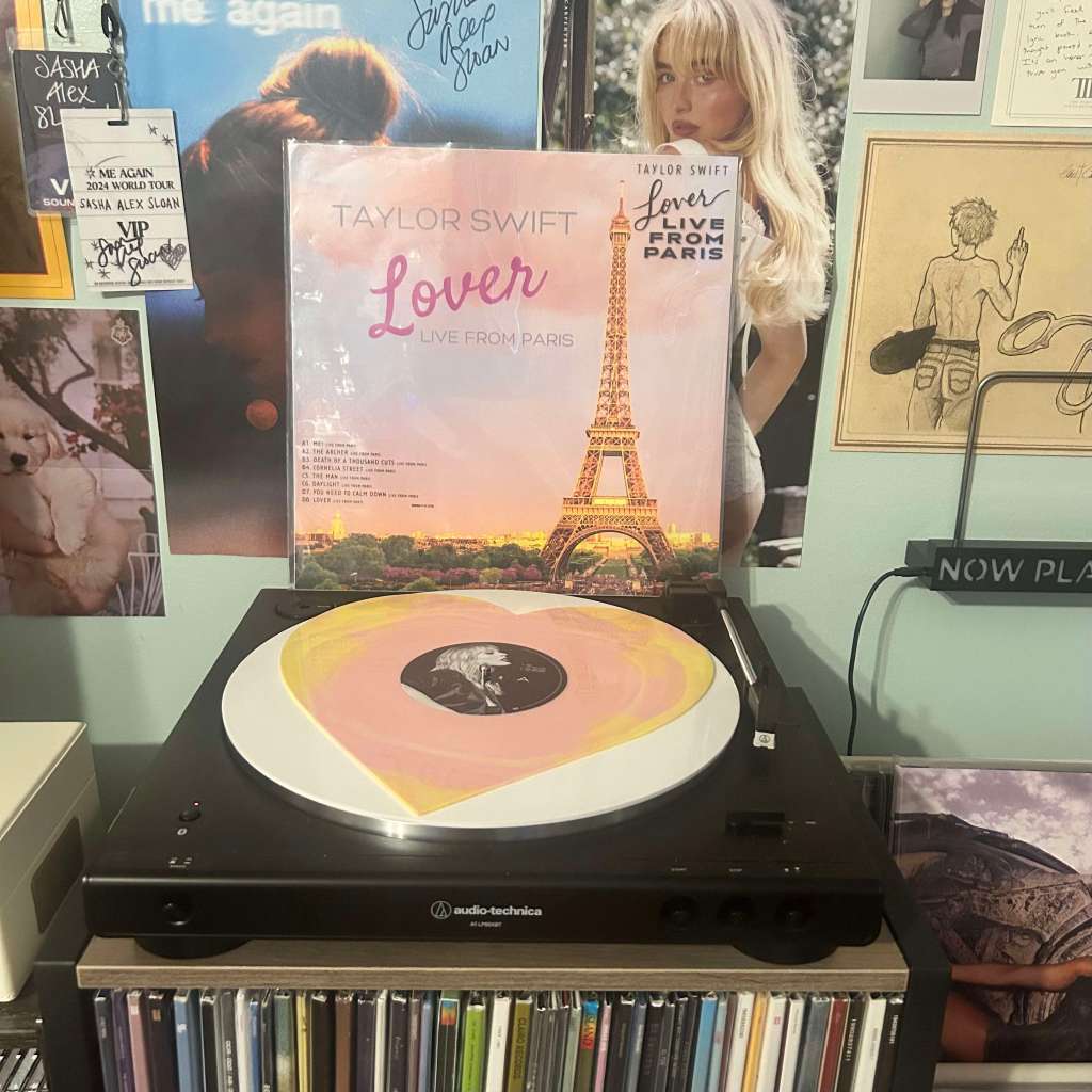 A heart-patterned vinyl of Taylor Swift – Lover (Live from Paris) spinning on an Audio-Technica LP60X, with the Eiffel Tower cover art behind it.
