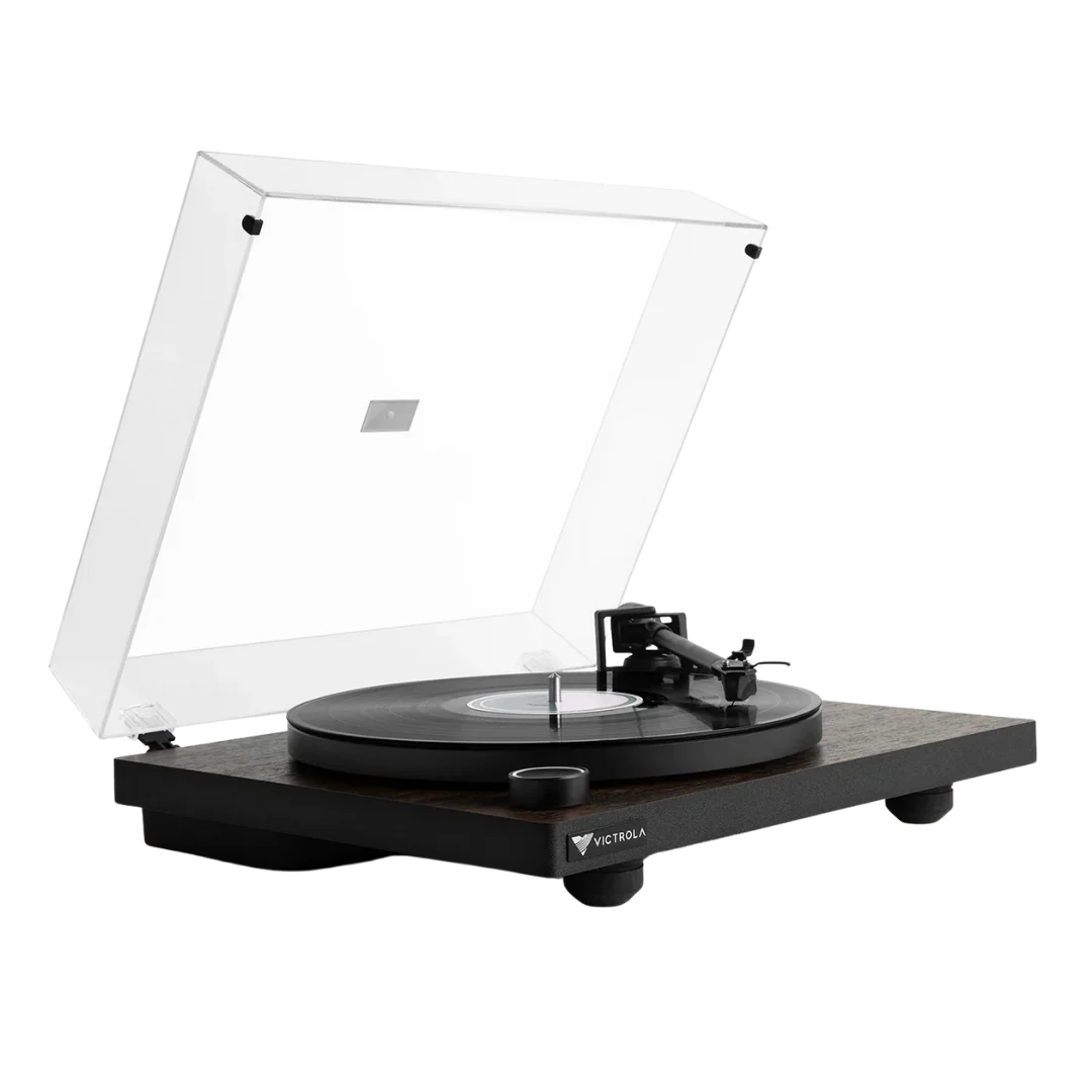 Victrola Premiere T1 turntable with a clear dust cover open, showing a vinyl record on the metal platter. The wooden plinth and minimalist black design highlight its modern yet classic look.