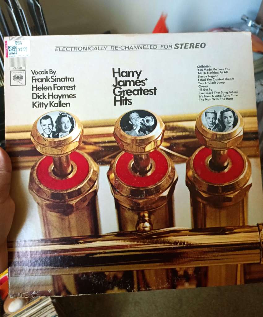 The cover of Harry James’ Greatest Hits, featuring close-up trumpet valves with small circular portraits of vocalists including Frank Sinatra and Helen Forrest inside the valve tops.