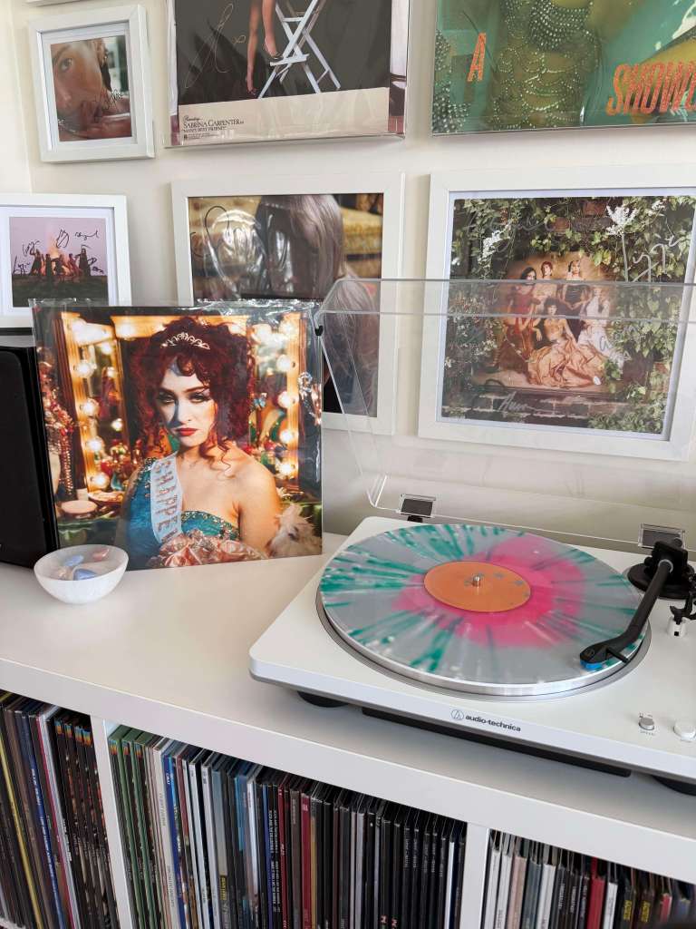 Chappell Roan — “The Rise and Fall of a Midwest Princess” clear LP with teal/pink splatter spinning on a white Audio-Technica.
