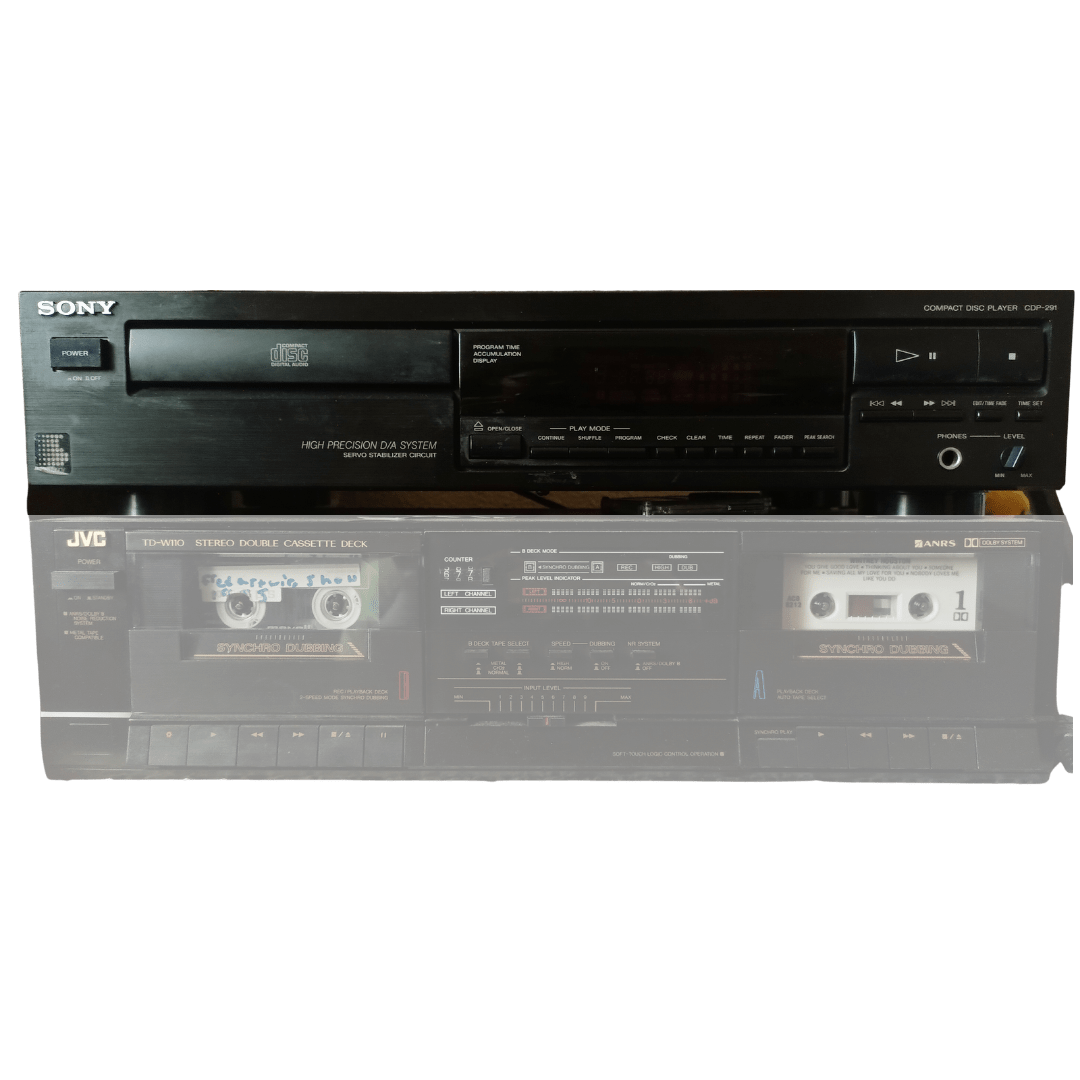 A vintage black Sony CD player stacked on top of a JVC stereo double cassette deck. The JVC deck features two cassette slots, labeled “Synchro Dubbing,” with one containing a handwritten mixtape. The units show classic analog controls, meters, and buttons, evoking a retro home audio setup.