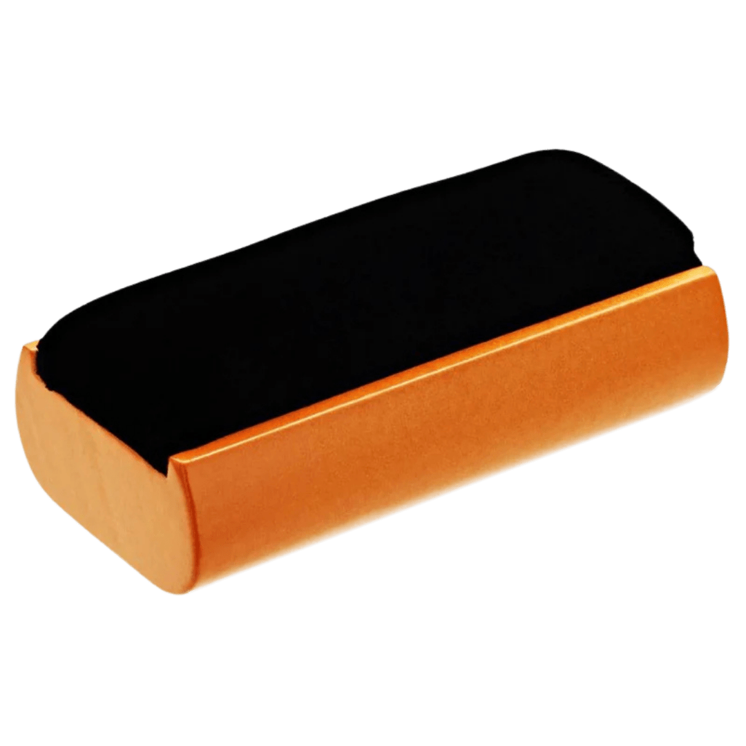 Velvet record-cleaning brush with a black pad and orange ergonomic handle, used to dust vinyl records before playing.