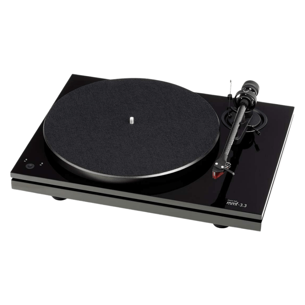 An audiophile-grade turntable with a sleek, high-gloss black finish is positioned at an angle against a solid black background. The turntable features a dual-plinth design with a distinct gap separating the top and bottom sections to isolate vibrations.